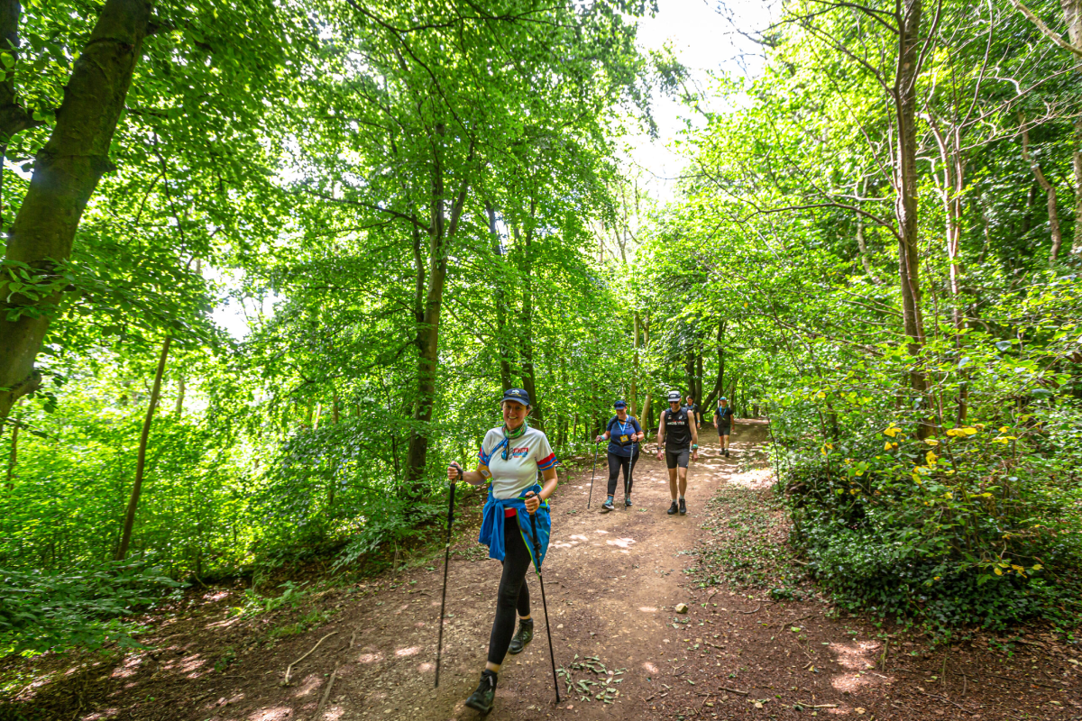 North Yorks Ultra Challenge Participants Walking Through Woodland Scaled